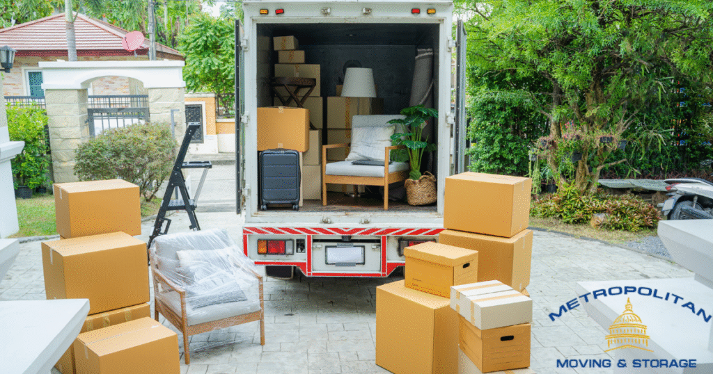 moving boxes sitting outside a moving truck Metropolitan Moving & Storage
