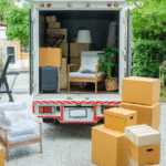 moving boxes sitting outside a moving truck Metropolitan Moving & Storage