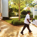 mover using a hand truck for moving Metropolitan Moving & Storage