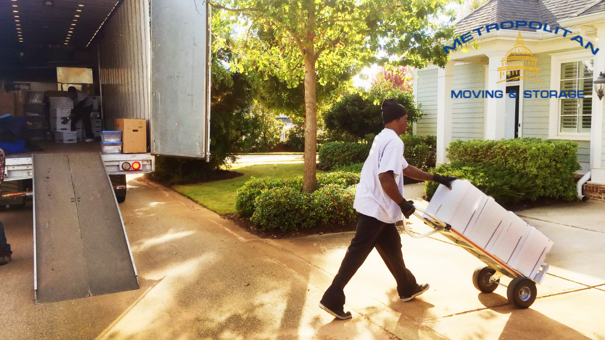 mover using a hand truck for moving Metropolitan Moving & Storage