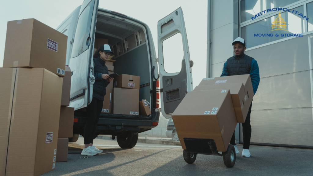 two movers packing moving truck Metropolitan Moving & Storage